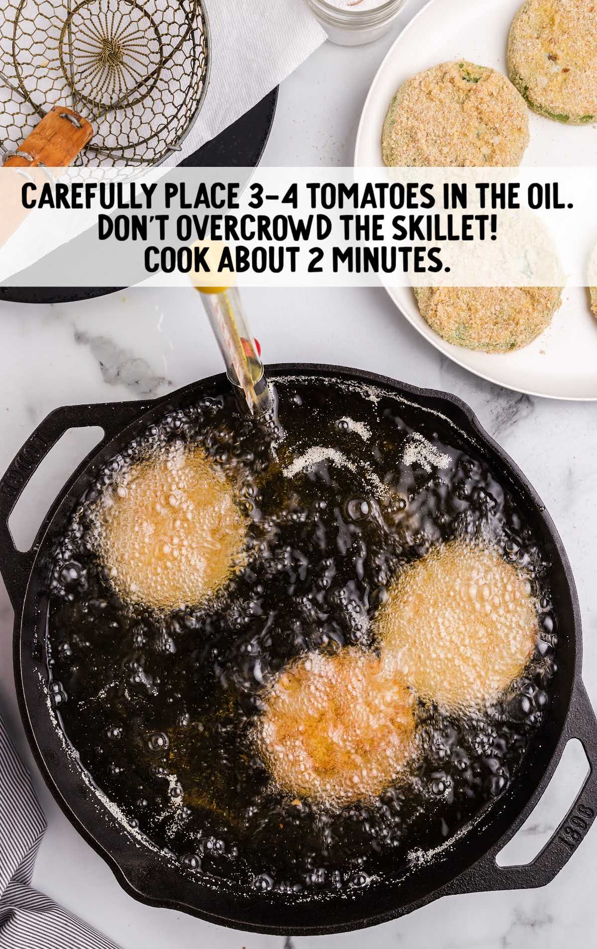 tomatoes being fried in hot oil