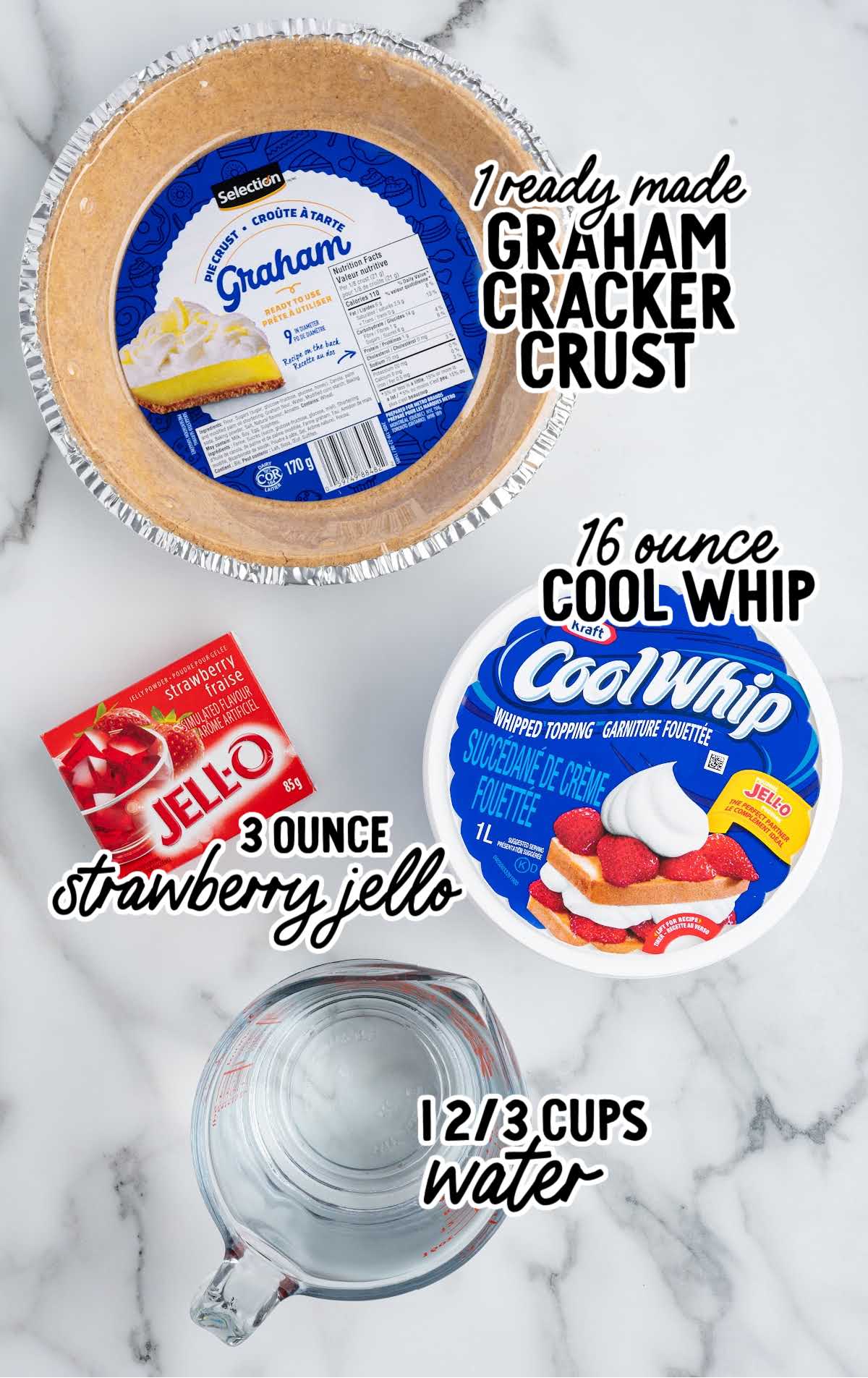 Labeled ingredients for jello pie including a graham cracker crust, strawberry jello, Cool Whip, and a measuring cup of water.