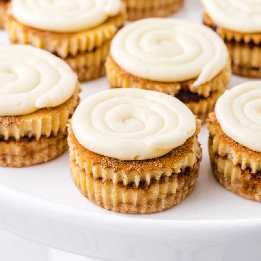 close up shot of mini cinnamon roll cheesecakes