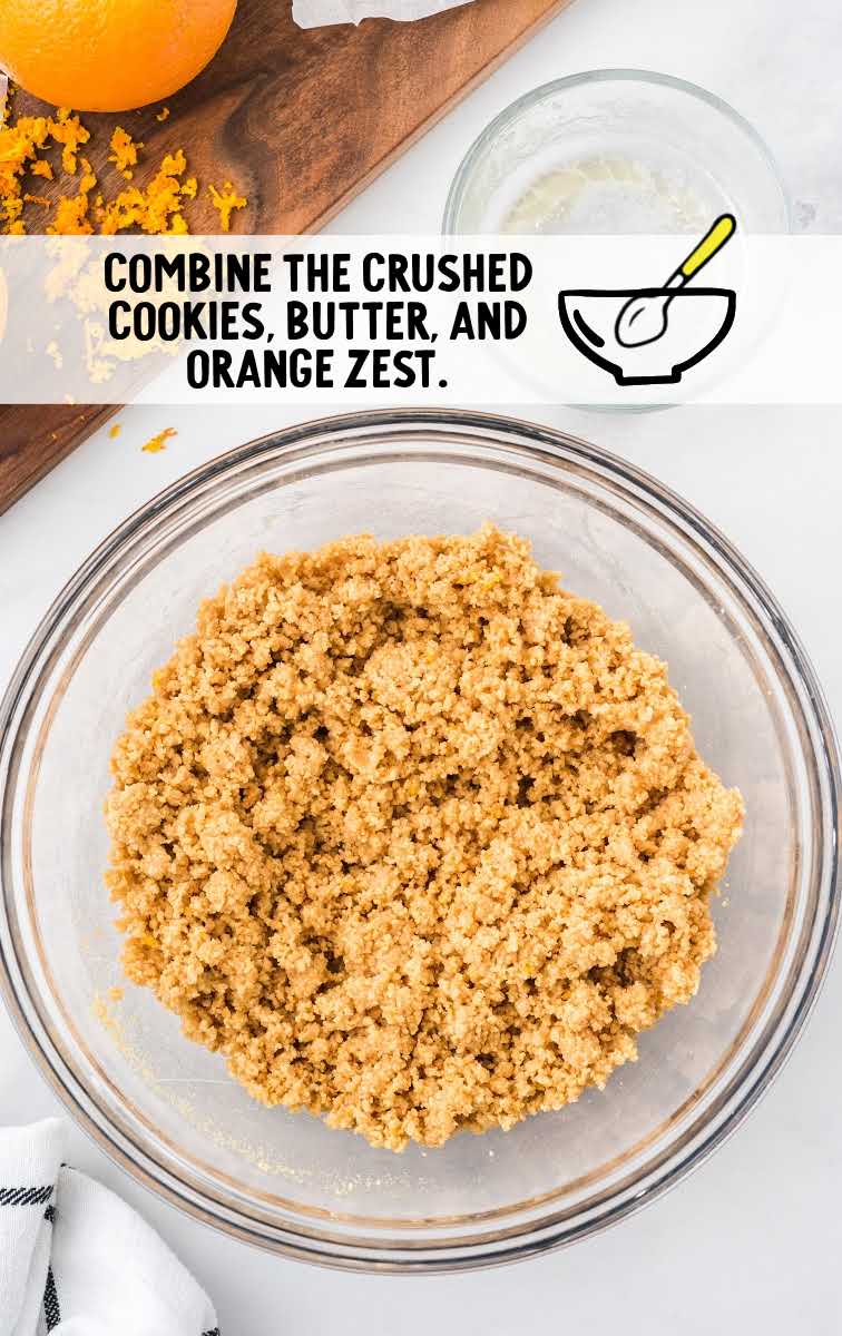 crushed cookies, butter, and orange zest combined in a bowl