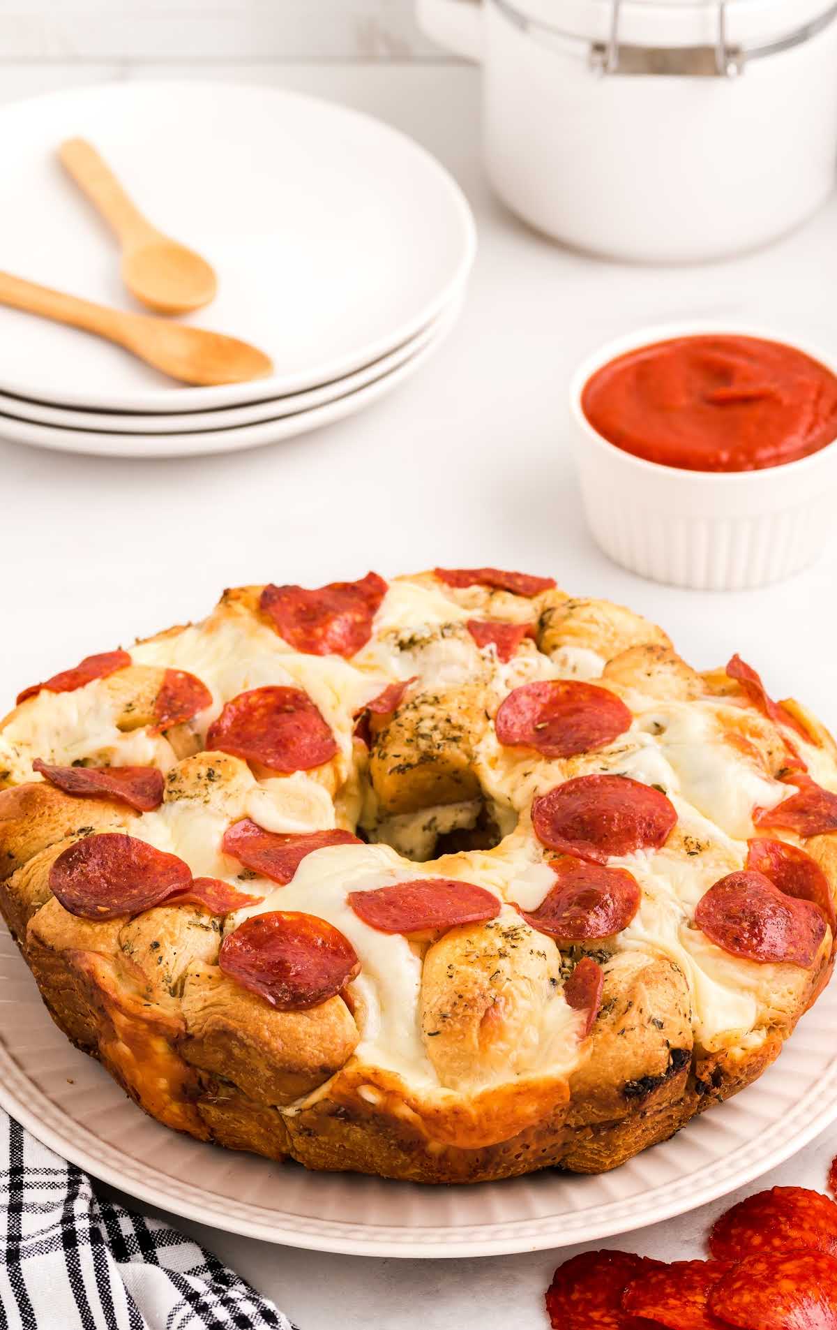 close up shot of a pizza bread on a large serving plate