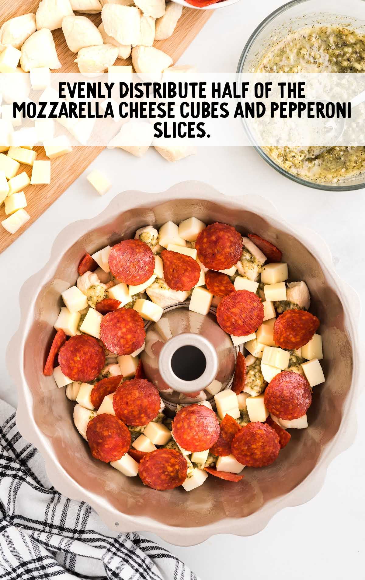 biscuit pieces topped with mozzarella cheese and pepperoni slices