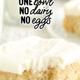 Vertical Pinterest image labeled "Depression Era Cake" featuring a bite-out slice of vanilla crazy cake with white frosting and text about no dairy or eggs.
