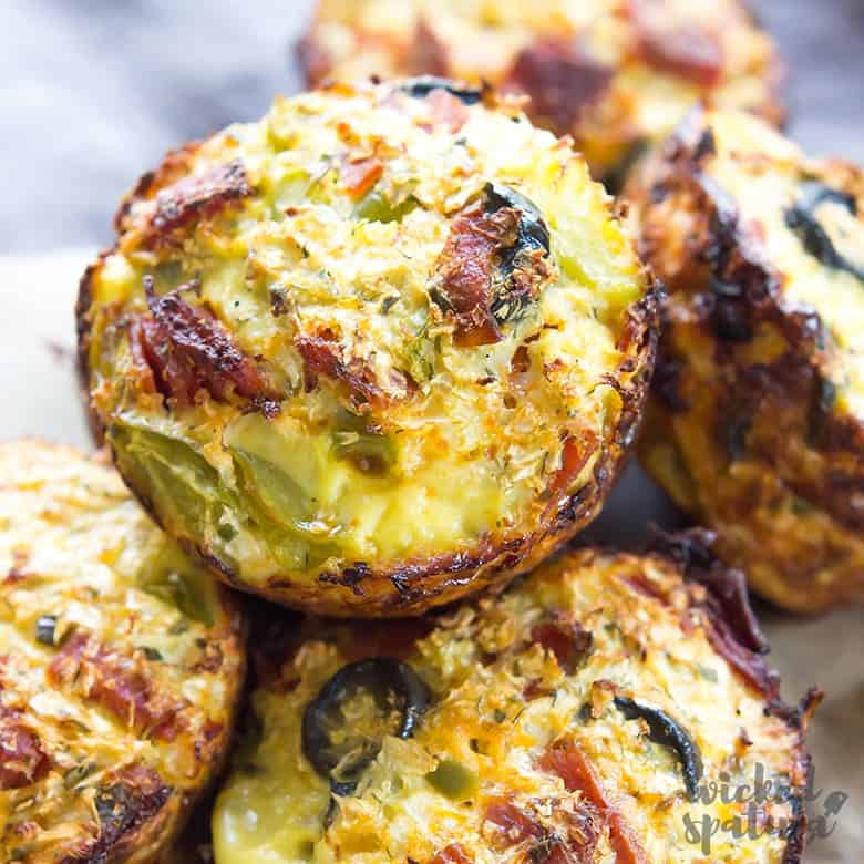 cauliflower pizza bites made into muffin shape and piled on top of each other