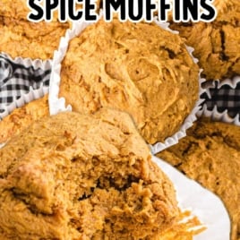 Pumpkin spice muffins in white liners with one broken open to show texture, text overlay โ2 ingredient pumpkin spice muffins, cake mix + pumpkin.โ