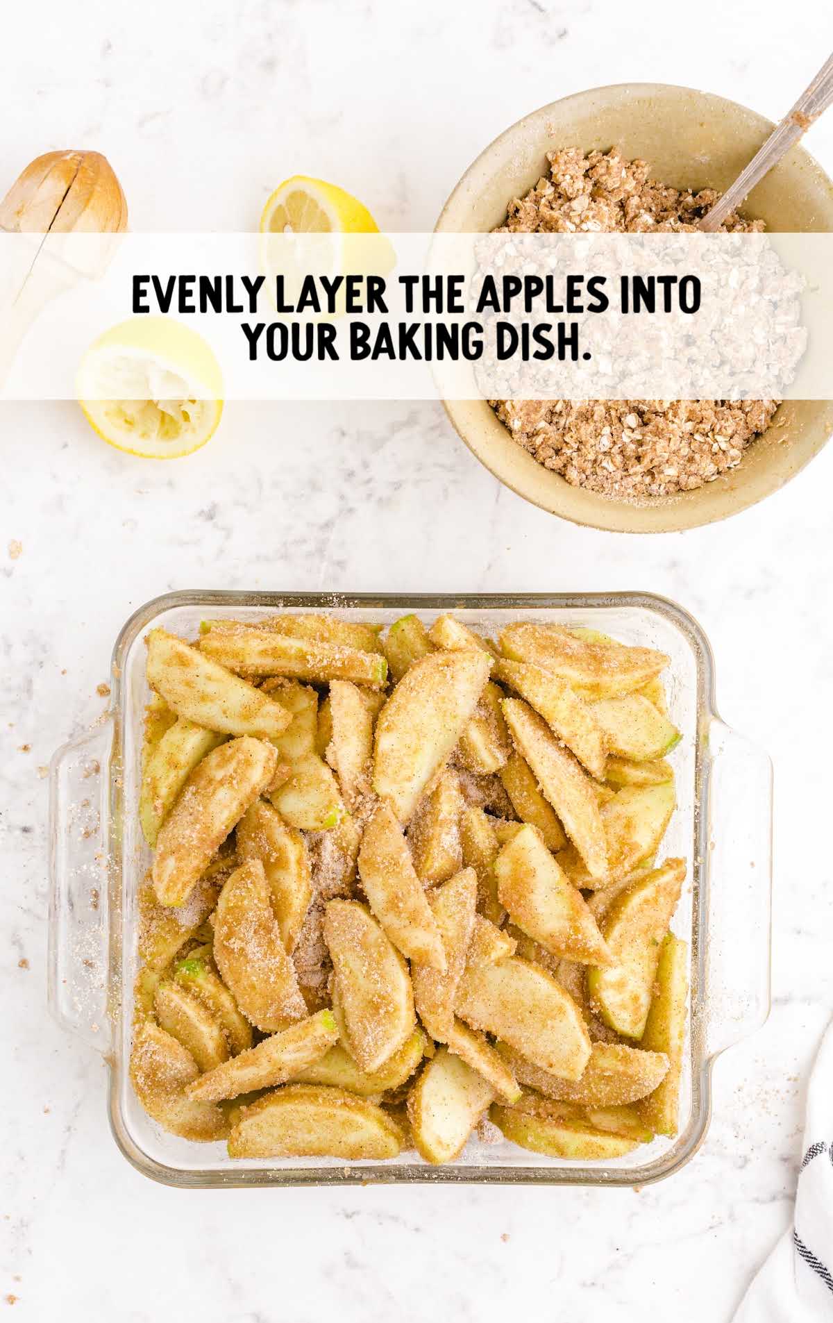 apples sprinkled with oat mixture in a baking dish