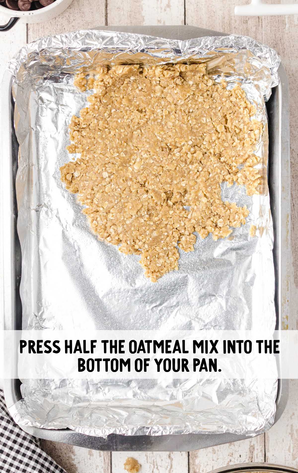 oatmeal mix pressed into the bottom of a pan