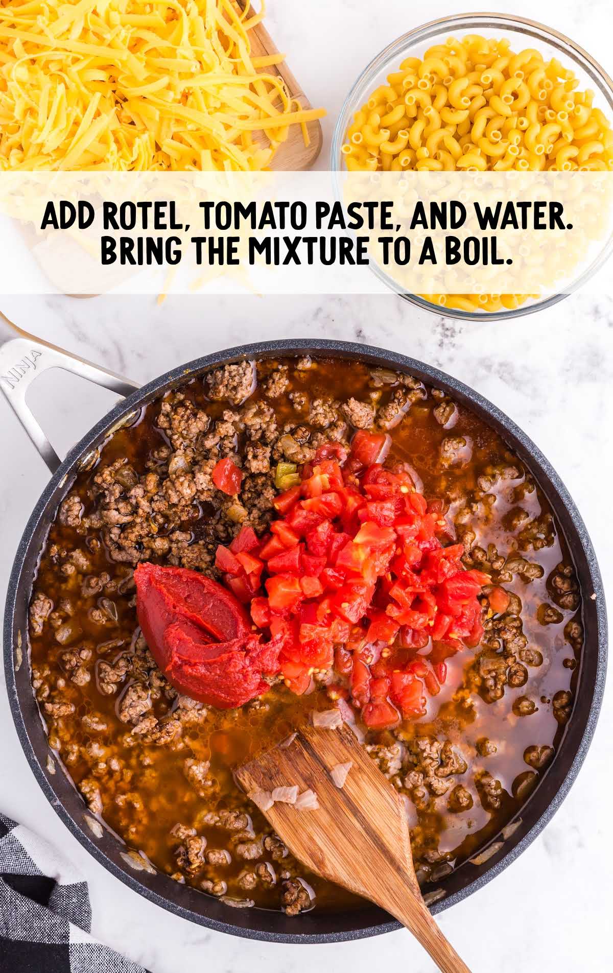 rotel, tomato paste, and water added to the pot of ground beef