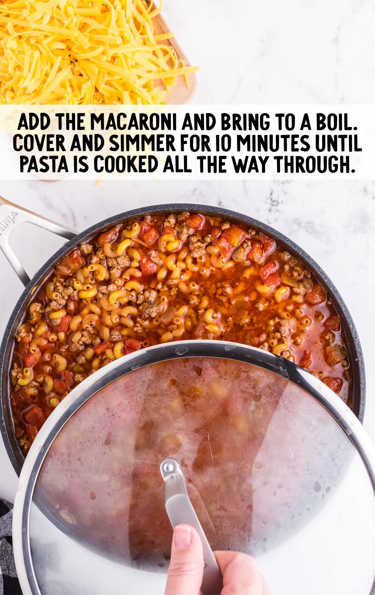 macaroni added to the pot of chili