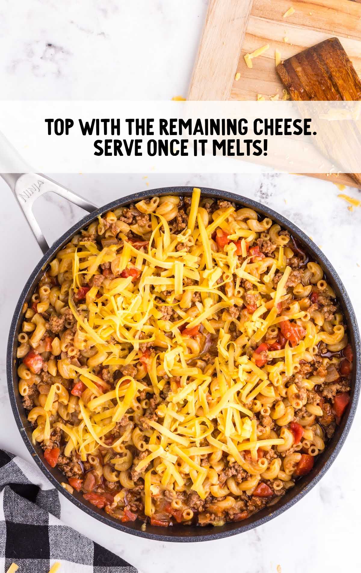 a pot of chili topped with cheese