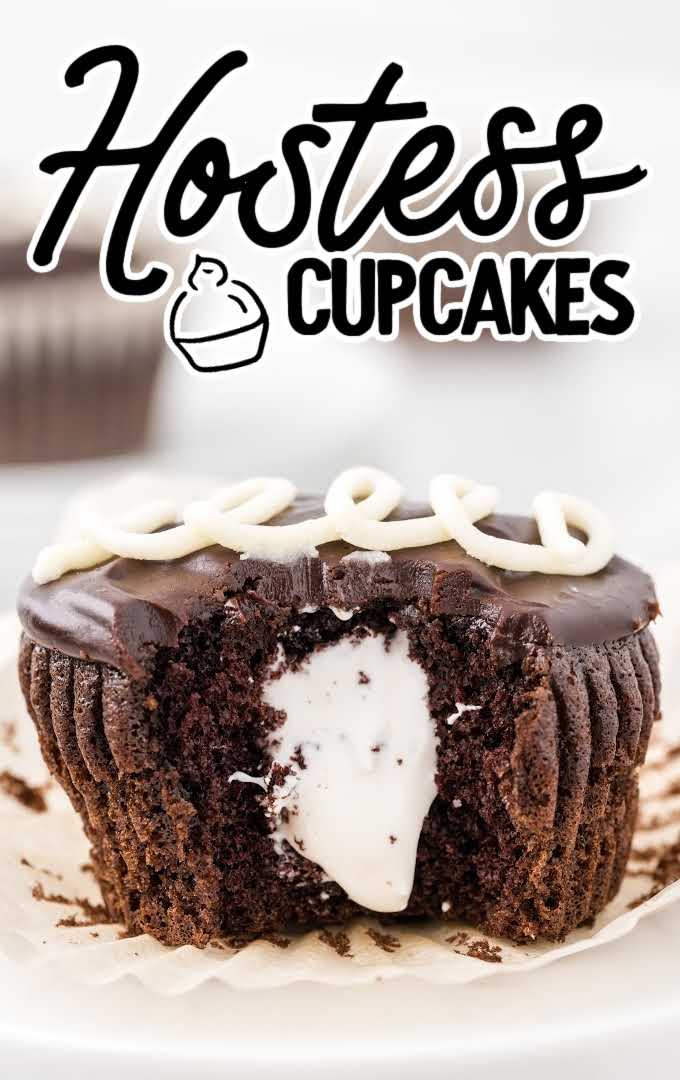 close up shot of Hostess Cupcakes with a piece taken out of it showing it's inside filling