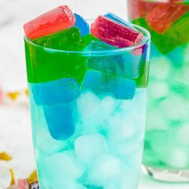 close up shot of glasses of Jolly rancher drink with ice and jolly ranchers