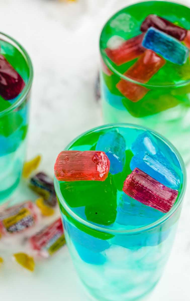 close up shot of glasses of Jolly rancher drink with ice and jolly ranchers