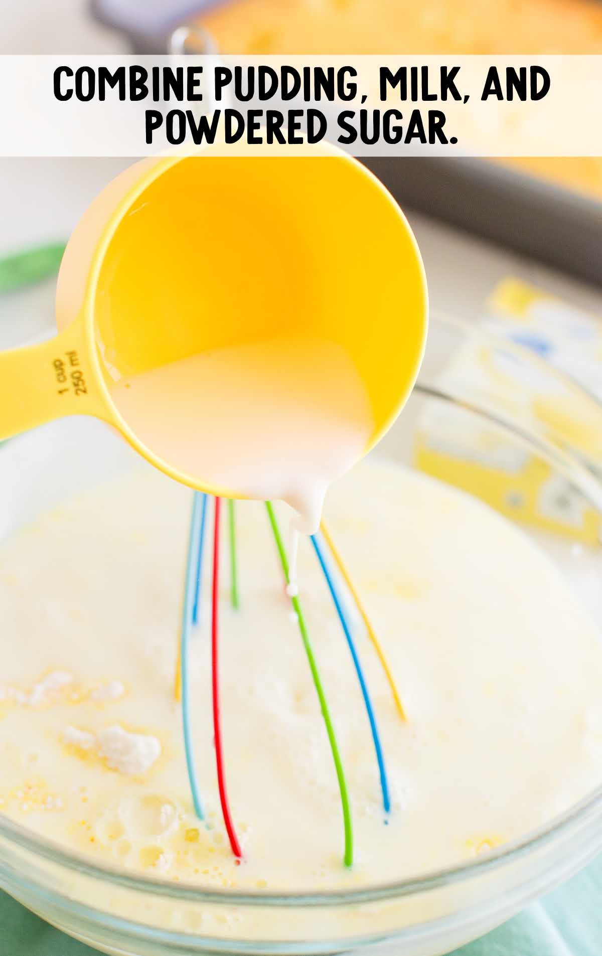 lemon poke cake process shot of ingredients being mixed together