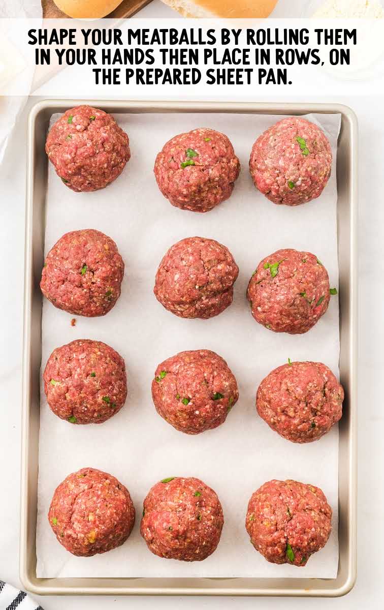 meatball subs process shot of meatballs place on a baking sheet pan