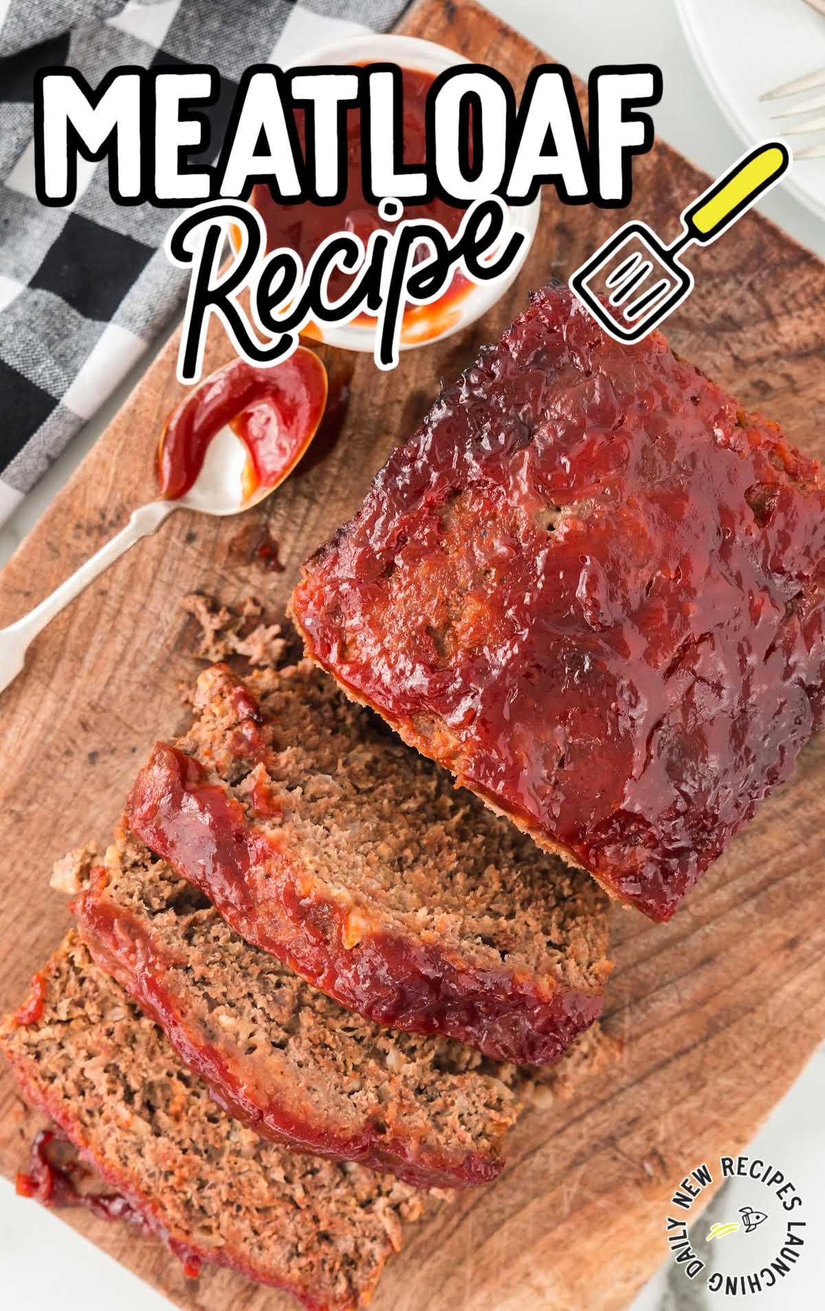 close up overhead shot of slices of meatloaf on a wooden board