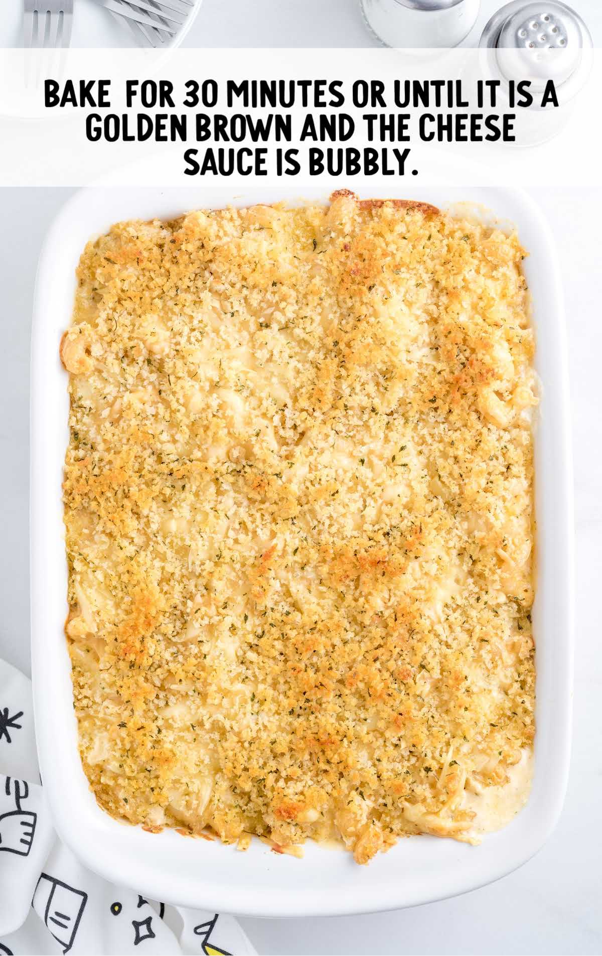 Mac and cheese being baked in a casserole dish