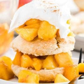 close up shot of Peach Shortcake on a plate with a fork