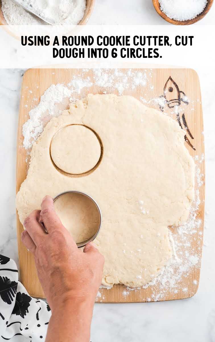 dough being cup with a cookie cutter