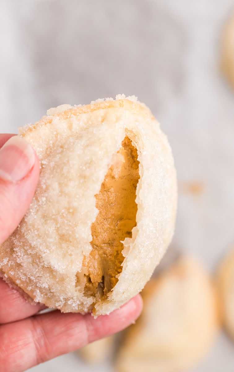 close up shot of Peanut Butter Lava Cookies being peeled apart by hand