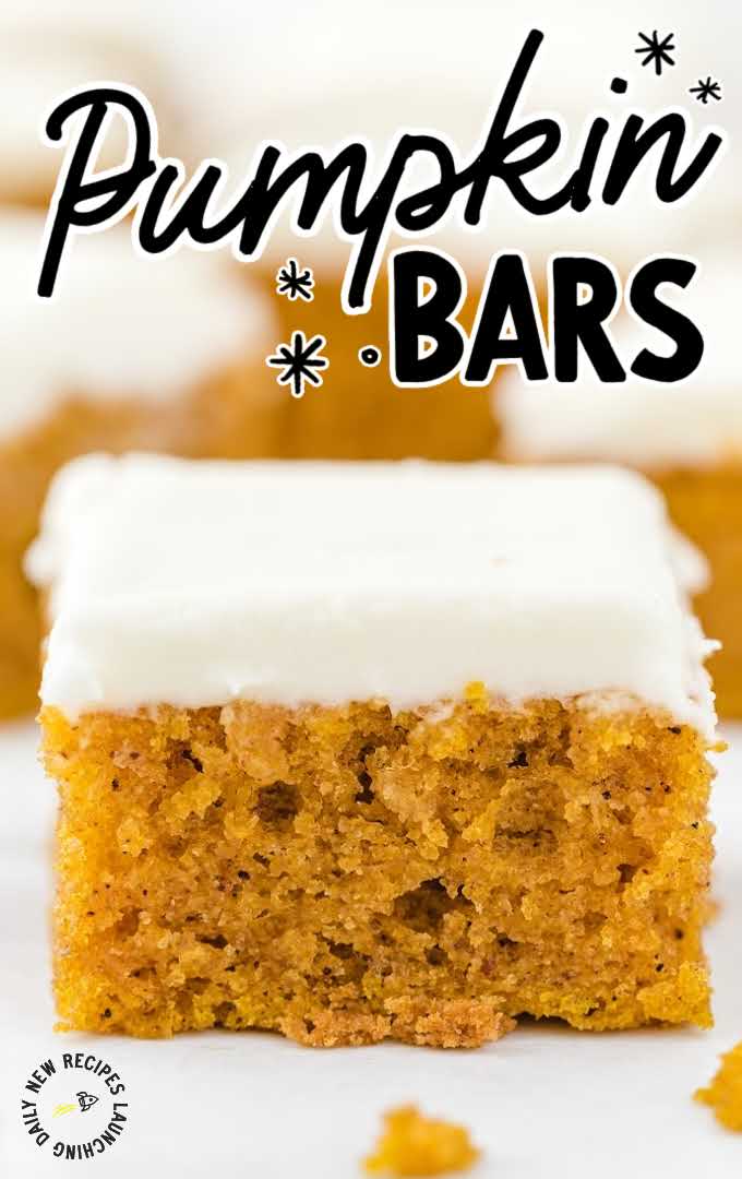 close up shot of pumpkin bars topped with cream cheese frosting