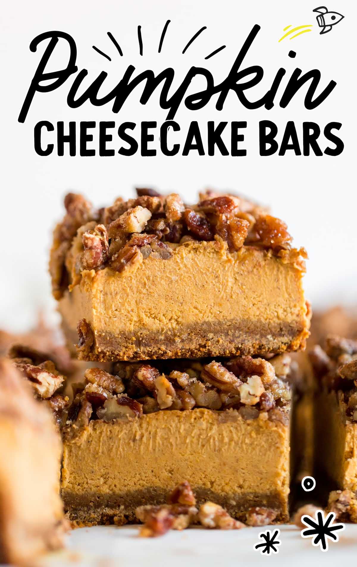 Close-up of a pumpkin cheesecake bar topped with candied pecans and a graham cracker crust