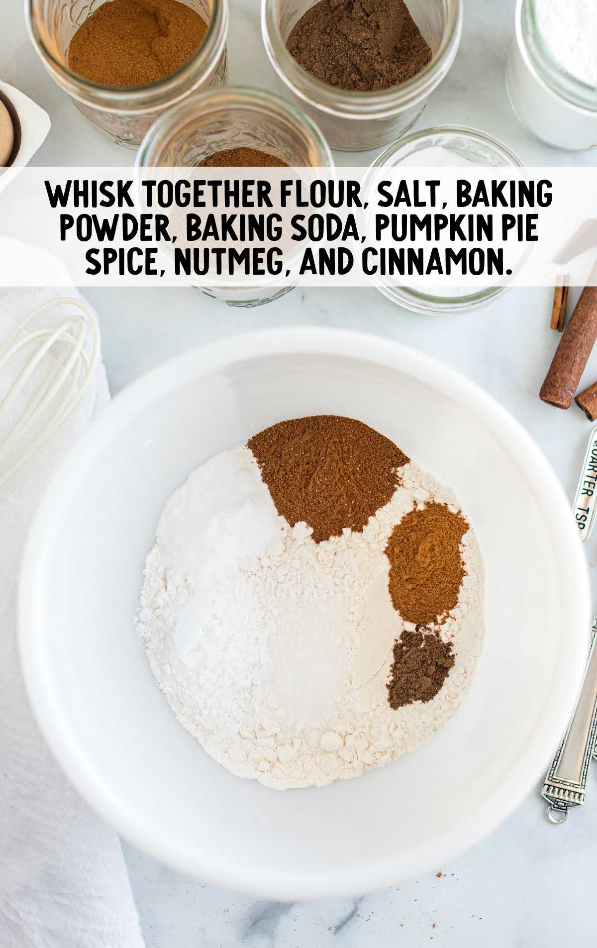 flour, salt, baking powder, baking soda, pumpkin pie spice, nutmeg, and cinnamon whisked together