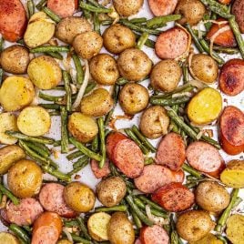 close up overhead shot of Sausage Green Bean Potato Casserole on a sheet pan