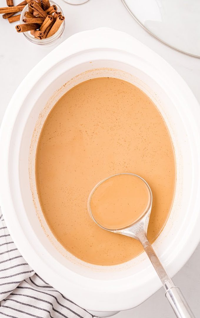 overhead shot of pumpkin spice latte in a slow cooker