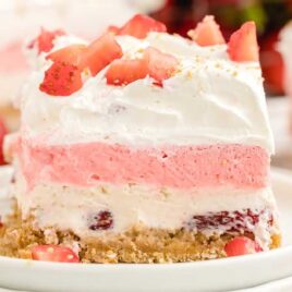 close shot of a slice of Strawberry Delight on a plate