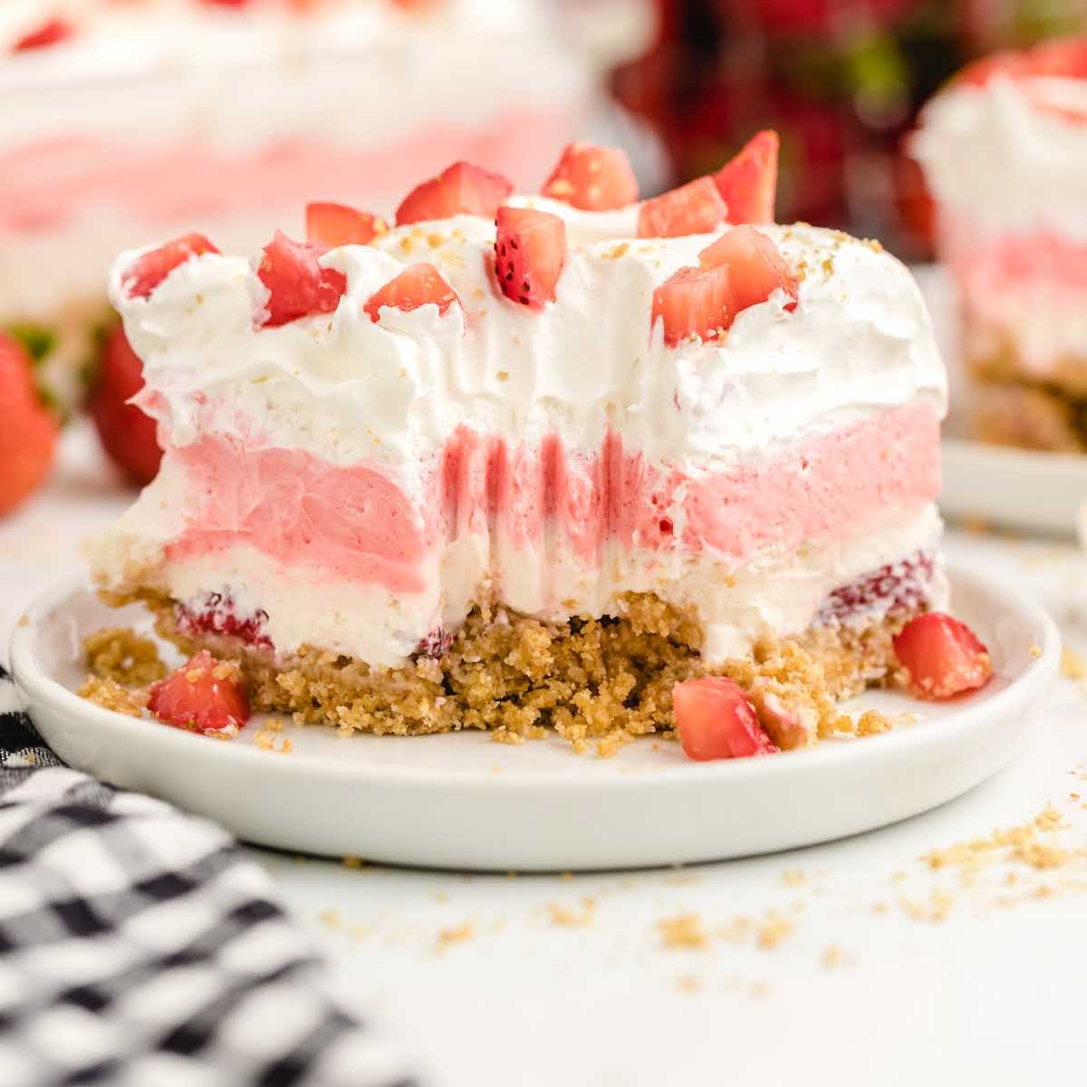 close shot of a slice of Strawberry Delight on a plate
