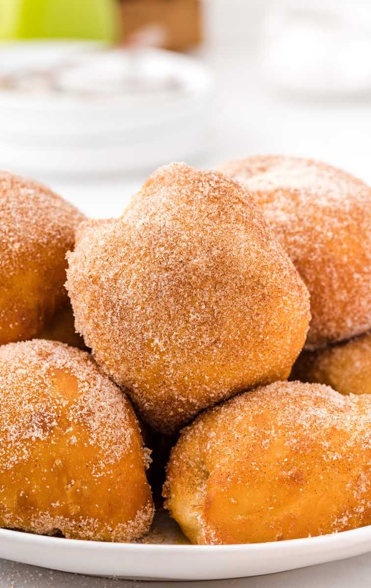 close up shot of caramel apple pie bombs piled on a plate