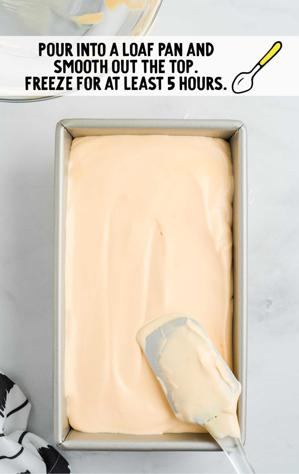  ice cream being smoothed out in a loaf pan