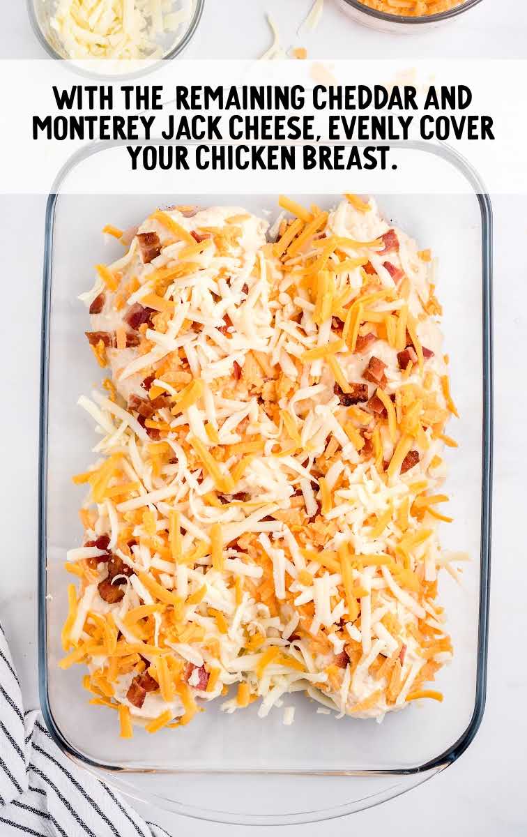 chicken topped with cheese in a baking dish