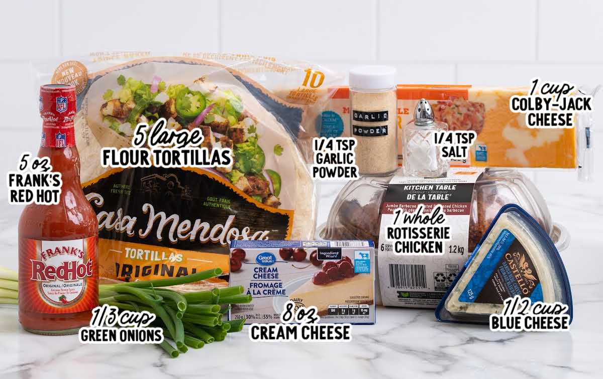 Ingredients for buffalo chicken pinwheels including flour tortillas, rotisserie chicken, cream cheese, blue cheese, green onions, garlic powder, salt, and hot sauce.