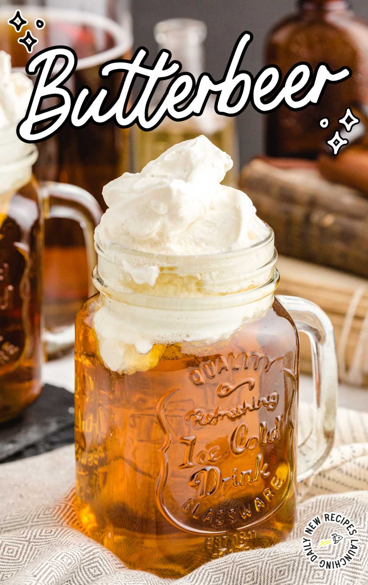 close up shot of a jug of Butterbeer topped with butter cream topping