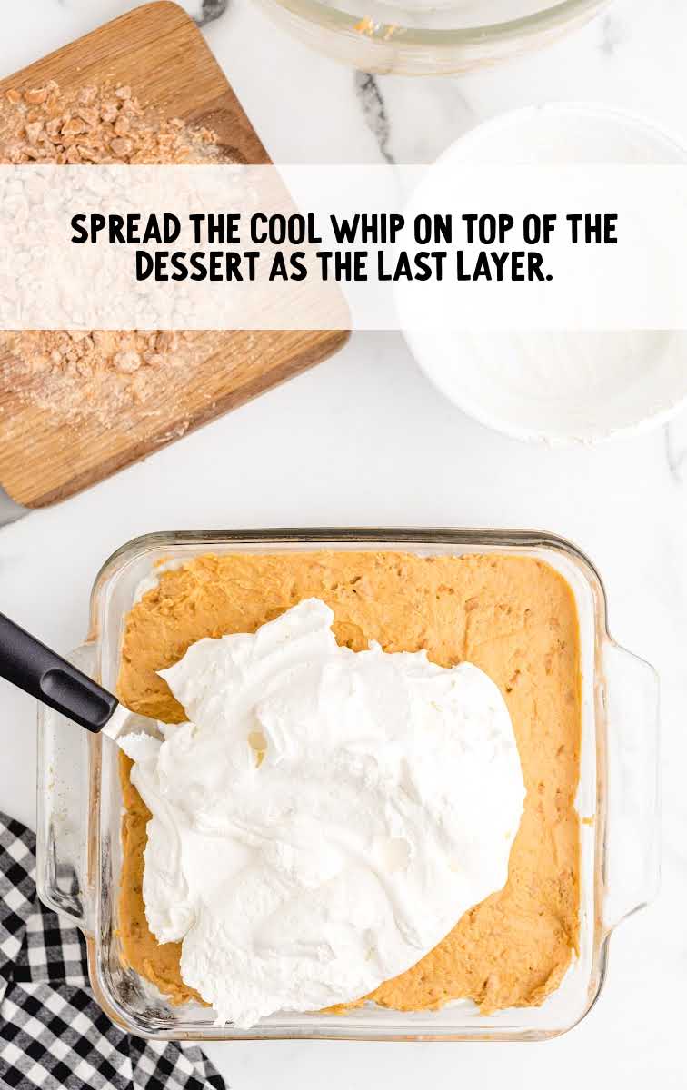cool whip spread on top of the pudding mixture in a baking dish
