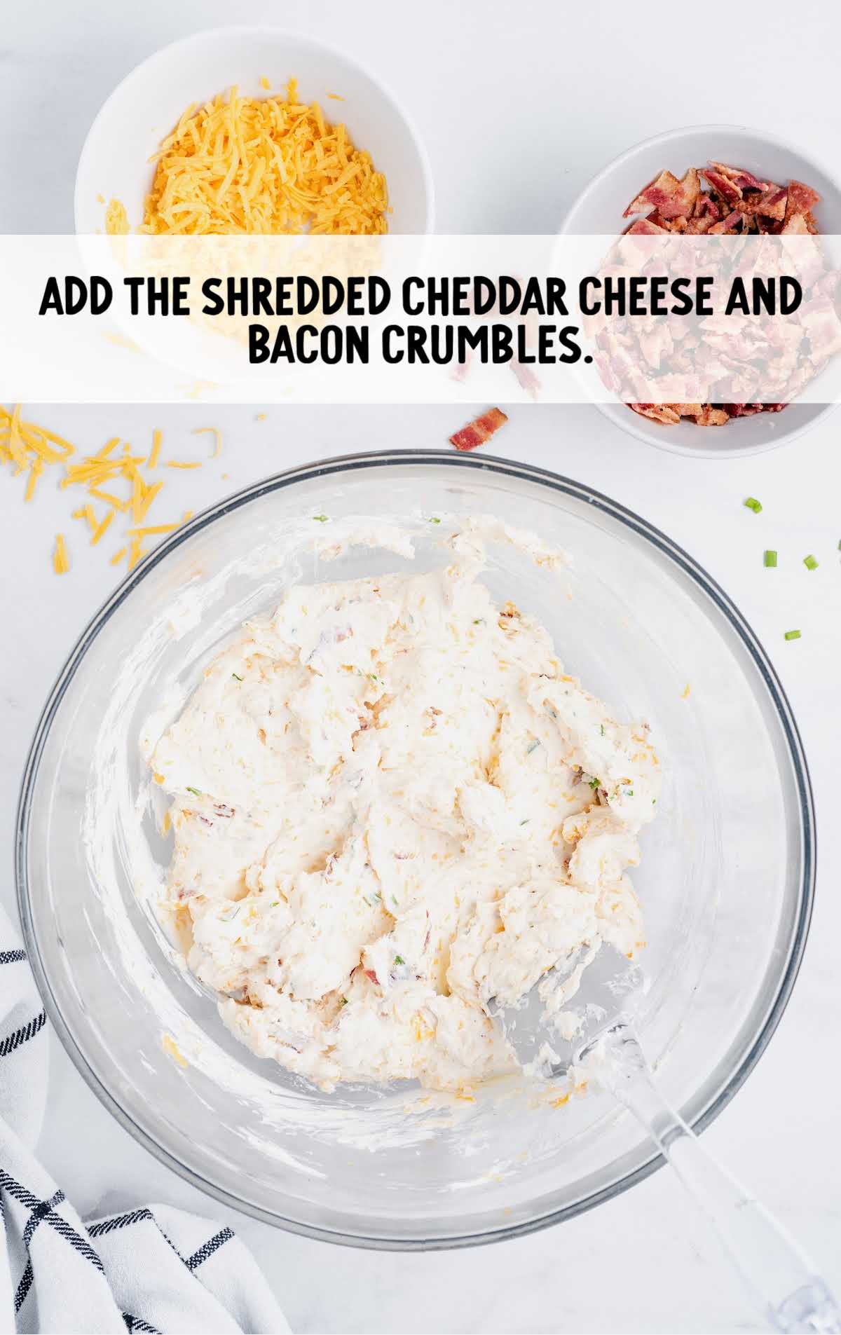 shredded cheddar cheese and bacon crumbs added to the cream cheese mixture