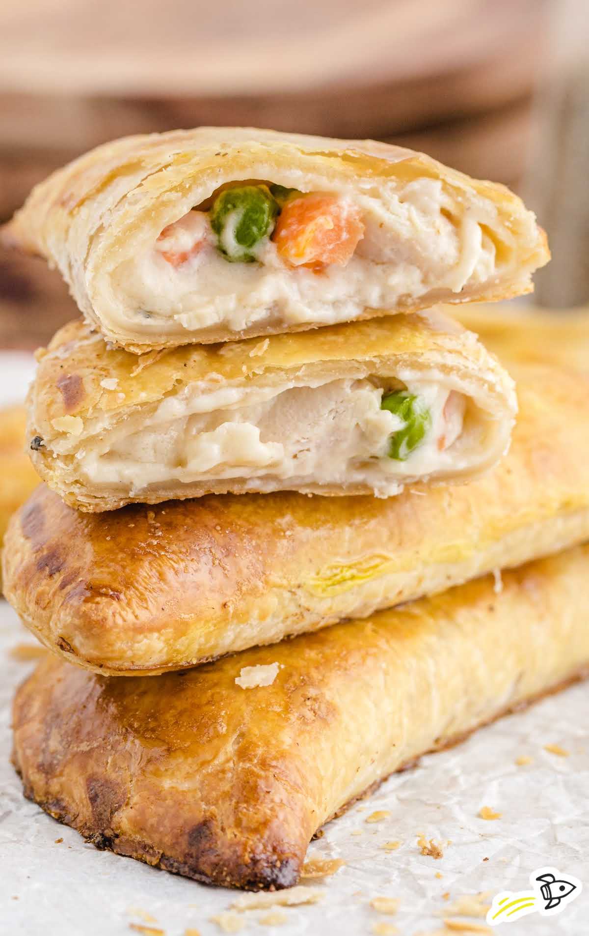 close up shot of Chicken Hand Pies stack on top of each other