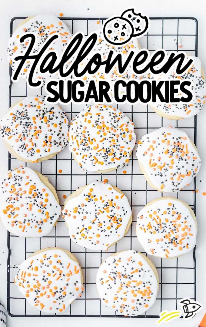 close up overhead shot of Halloween Sugar Cookies topped with icing and sprinkles on a cooling rack