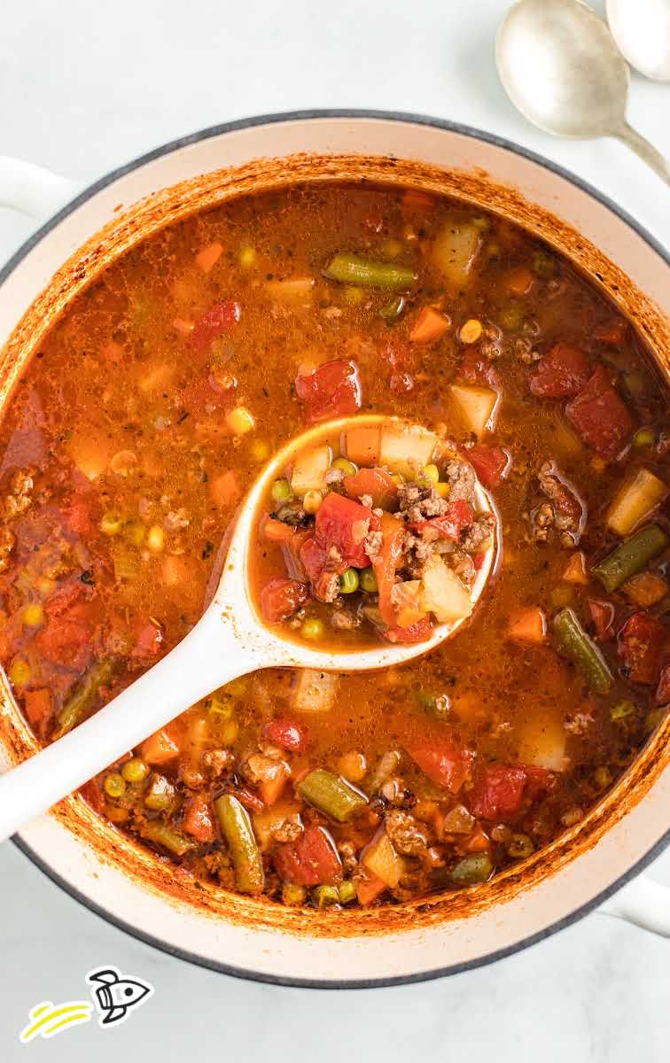 close up overhead shot of hamburger soup in a pot