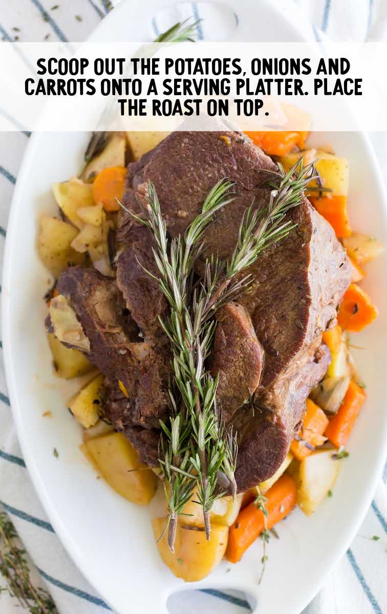instant pot pot roast process shot of roast served over carrots and potatoes on a plate