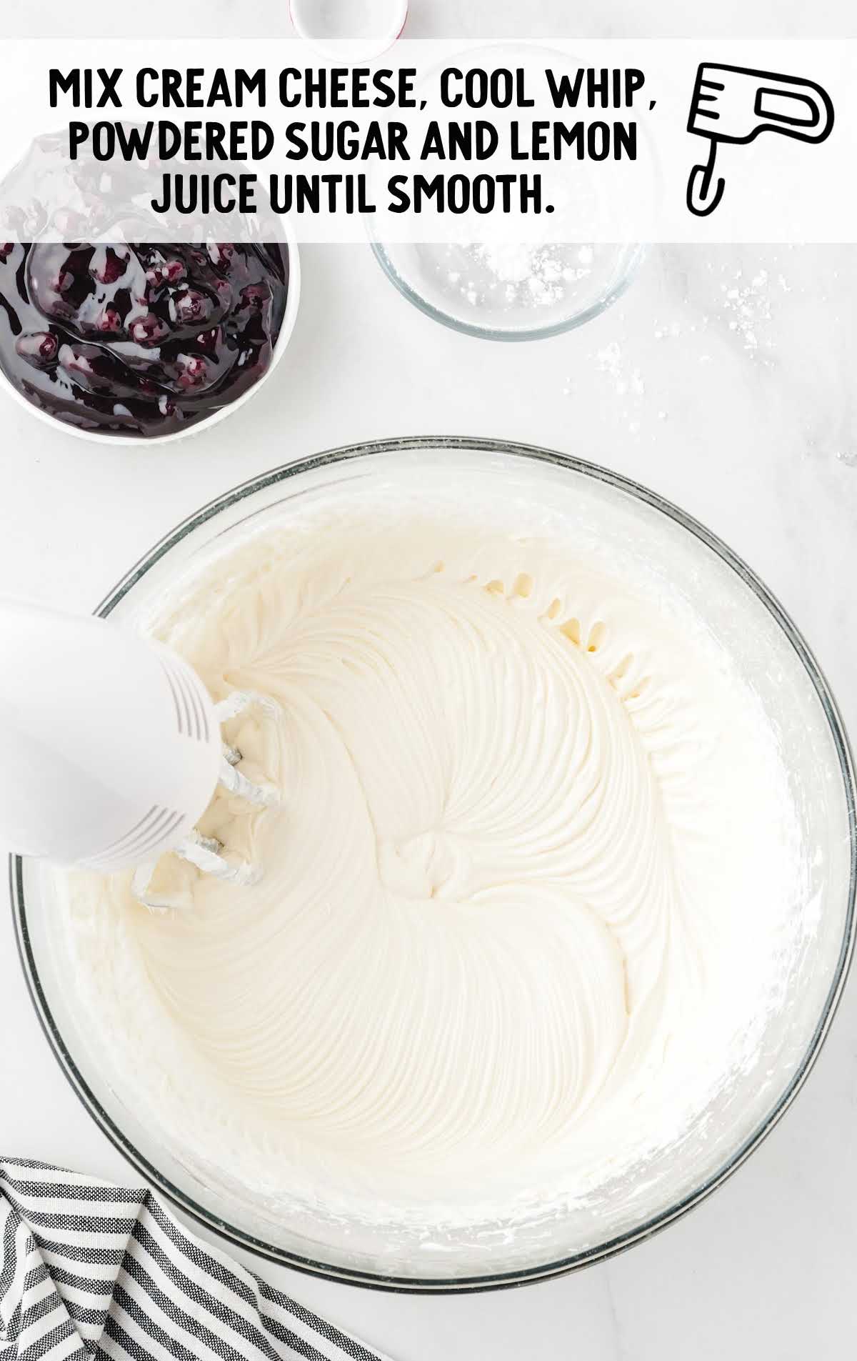 No Bake Blueberry Cheesecake process shot of ingredients being blended together in a bowl
