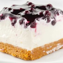 close up shot of a slice of No Bake Blueberry Cheesecake on a plate
