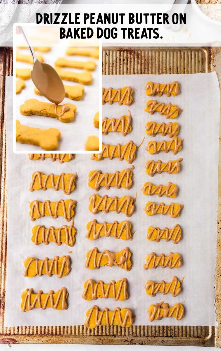 Pumpkin Dog Treats process shot of peanut butter being drizzled onto baked dog treats