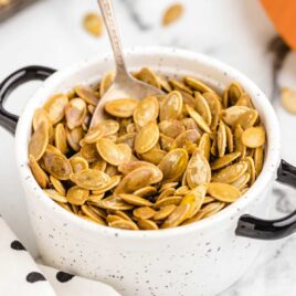 closeup shot of Roasted Pumpkin Seeds in a cup