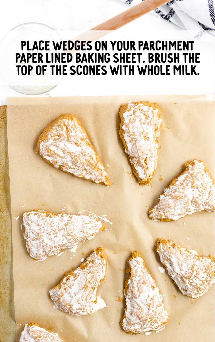 Starbucks Copycat Pumpkin Scones process shot of milk brushed on top of scones