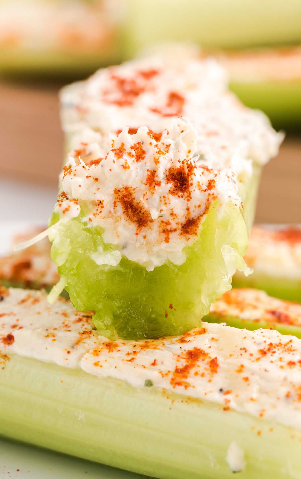 Celery stuffed with a cream cheese filling and topped with smoked paprika