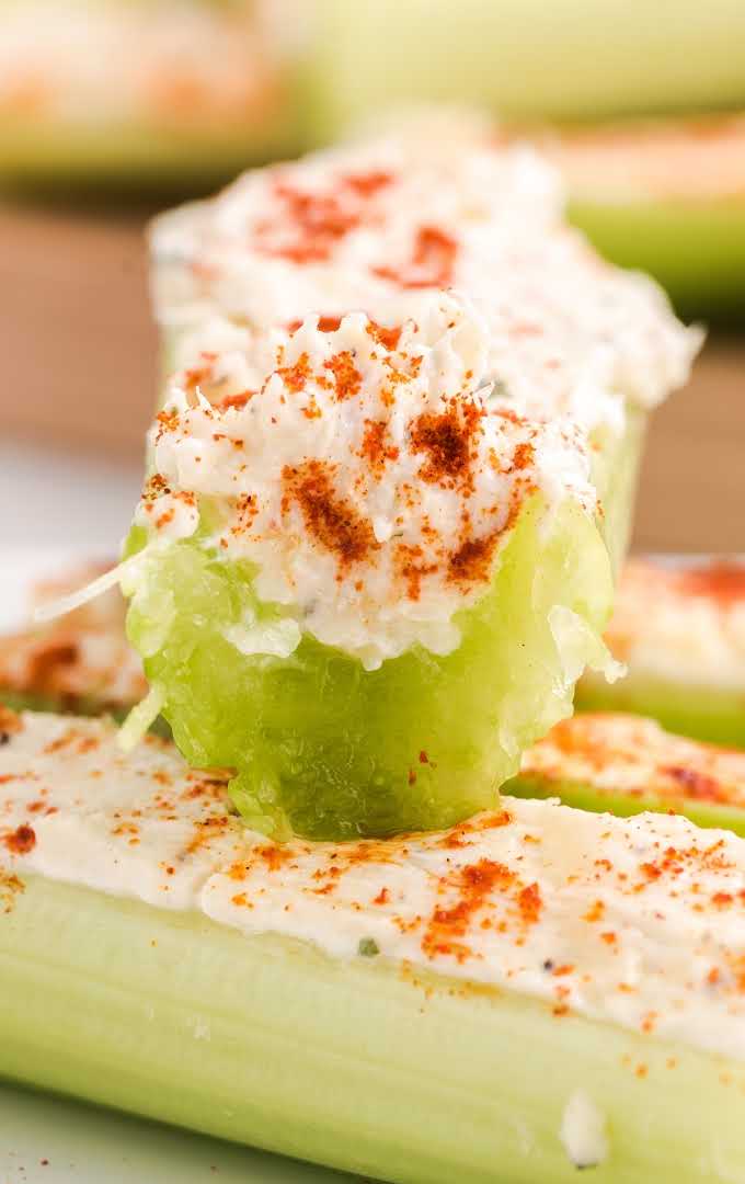close up shot of Stuffed Celery topped with smoked paprika