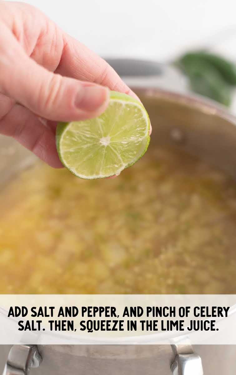 White Bean Chili process shot of lime being squeezed into pot of soup